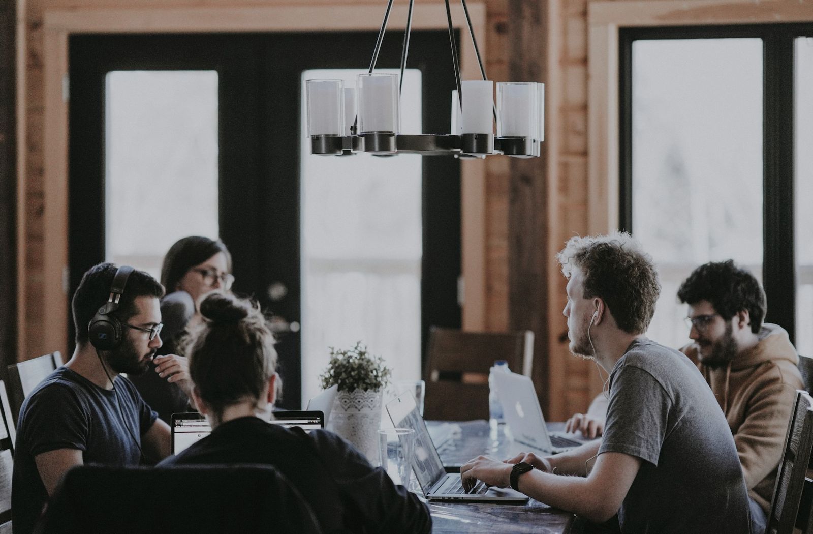 A group of colleagues working together around a large table